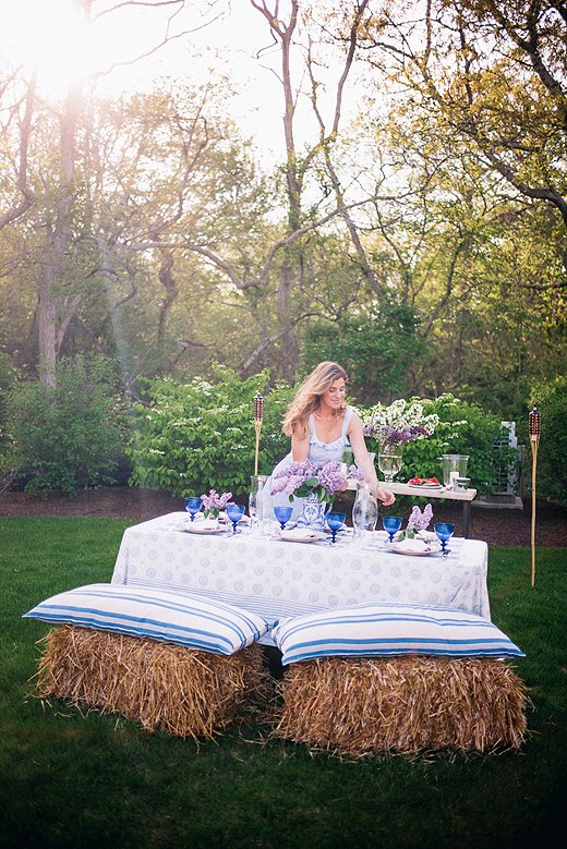 For extra seating, Lucy used hay bales topped with pillows. “It’s so great on the grass because it avoids that chair-sinking-into-the-ground uneven-seating issue.” Photo by Lucy Cuneo.
